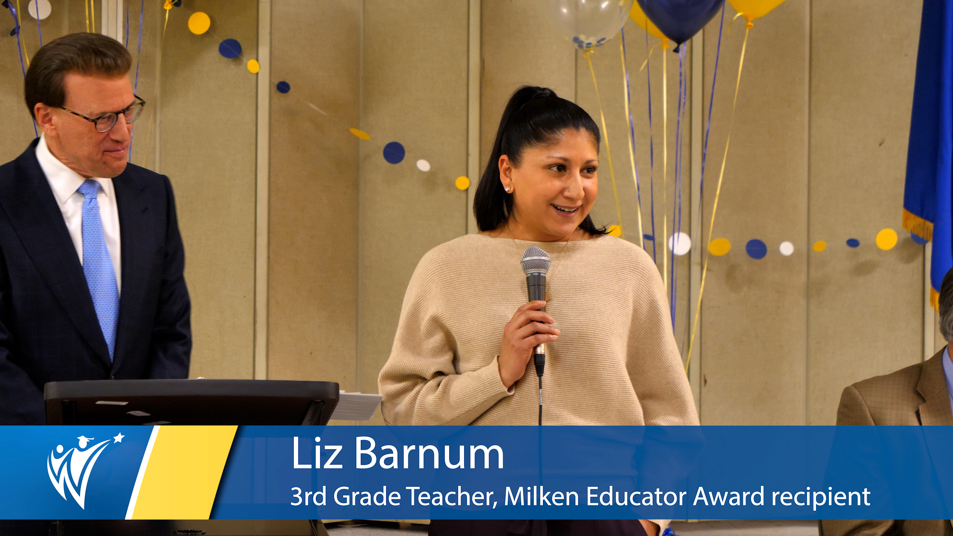  Teacher holding a microphone